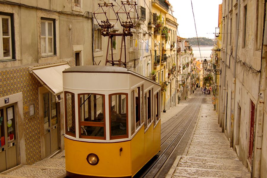 A photo of a tram in Lisbon on a sunny day.