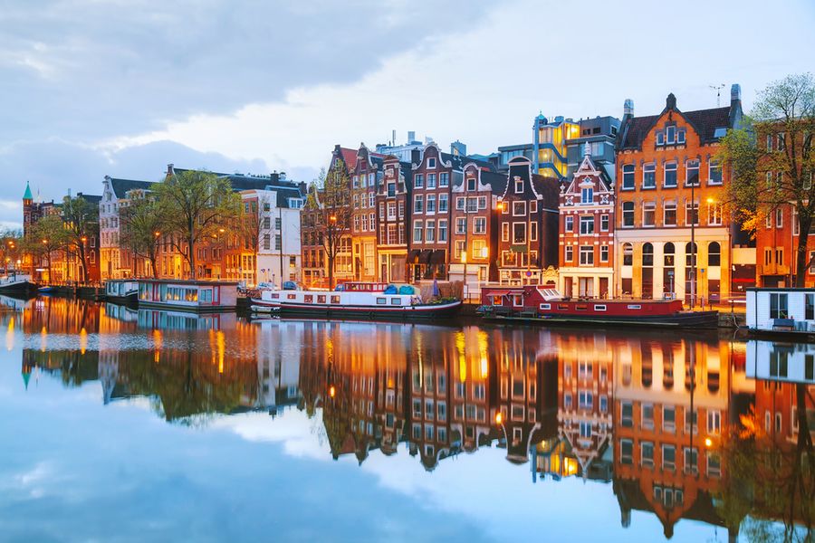 A photo of buildings in Amsterdam on the edge of a canal