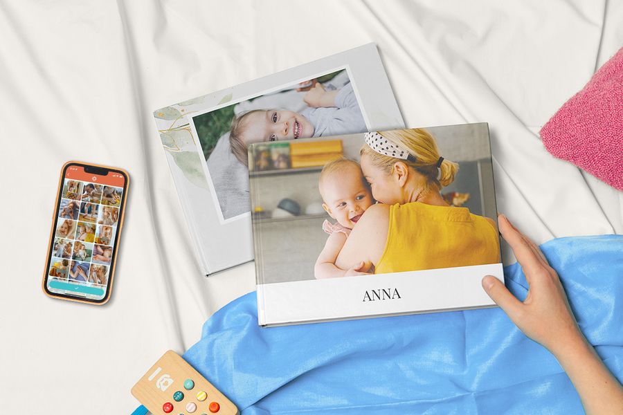 Two photo books on top of fabric